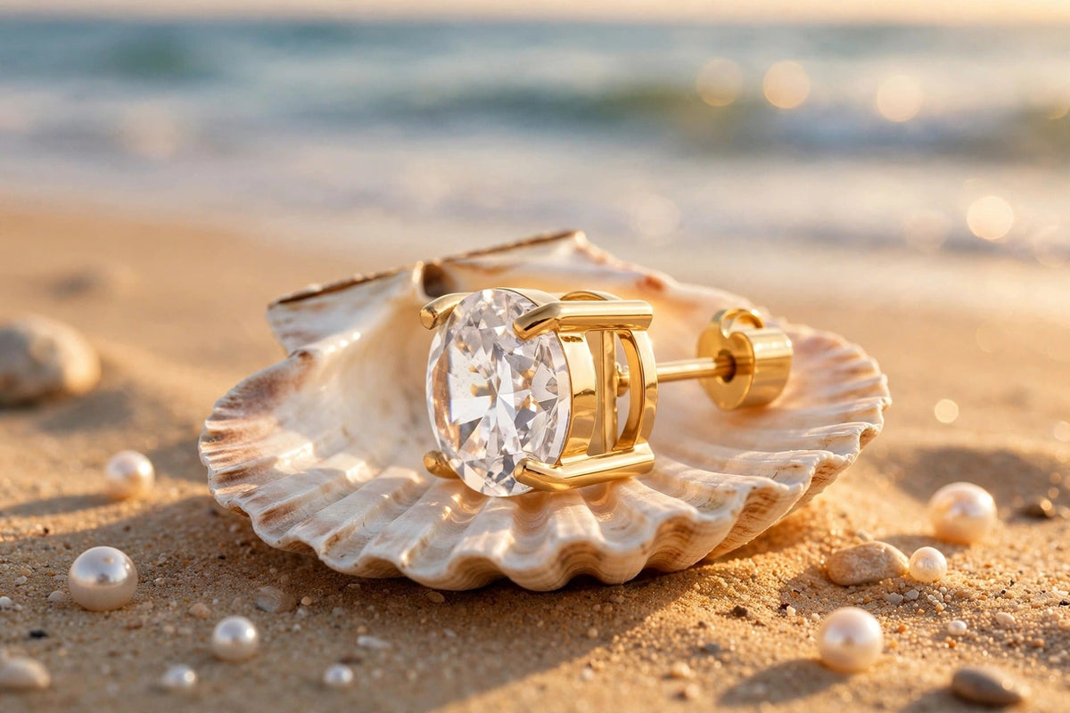 Elara gold stud styled on seashell at the beach