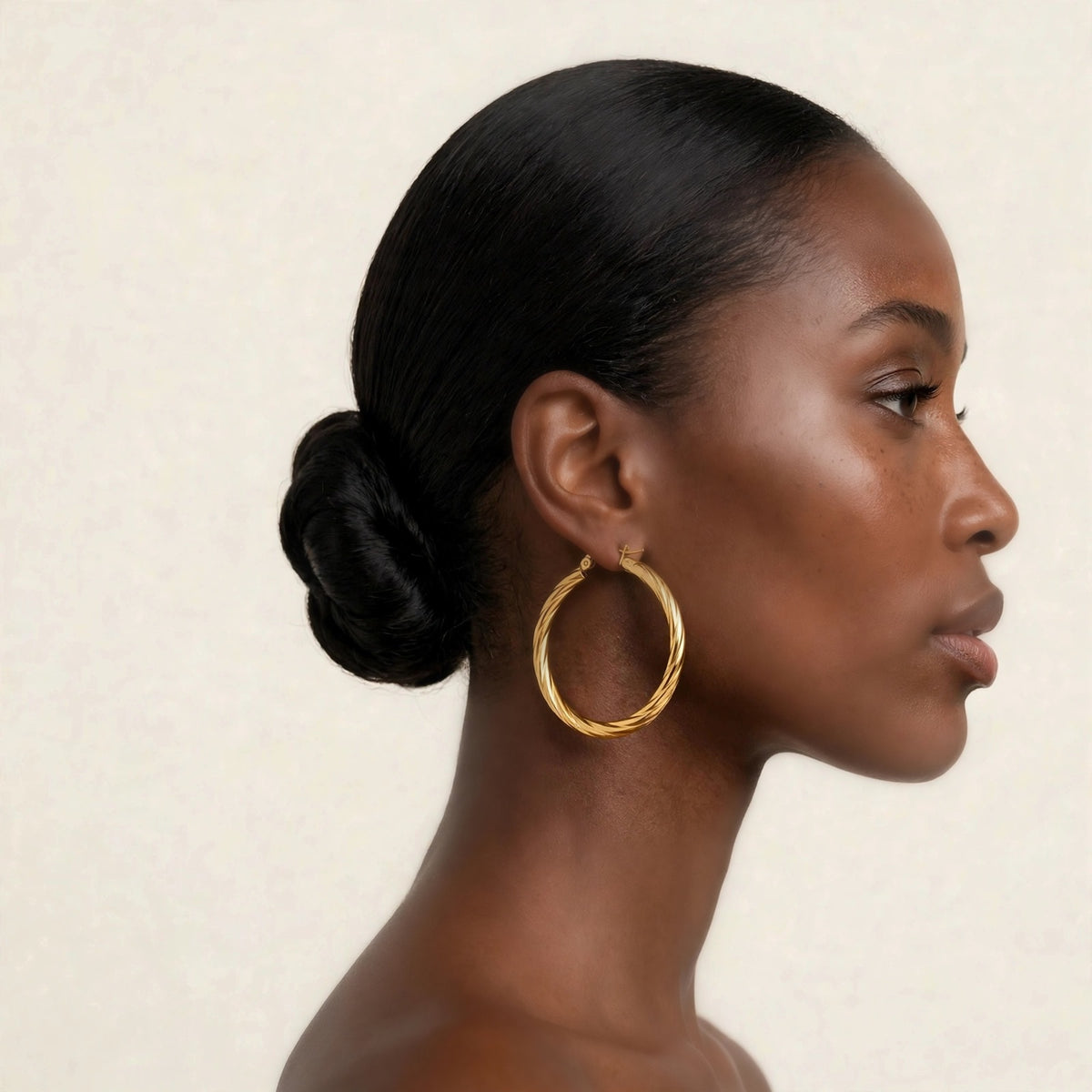 Rosali hoops in gold, elegant side-profile on model