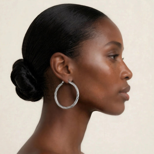 Rosali hoops in steel, elegant side-profile on model