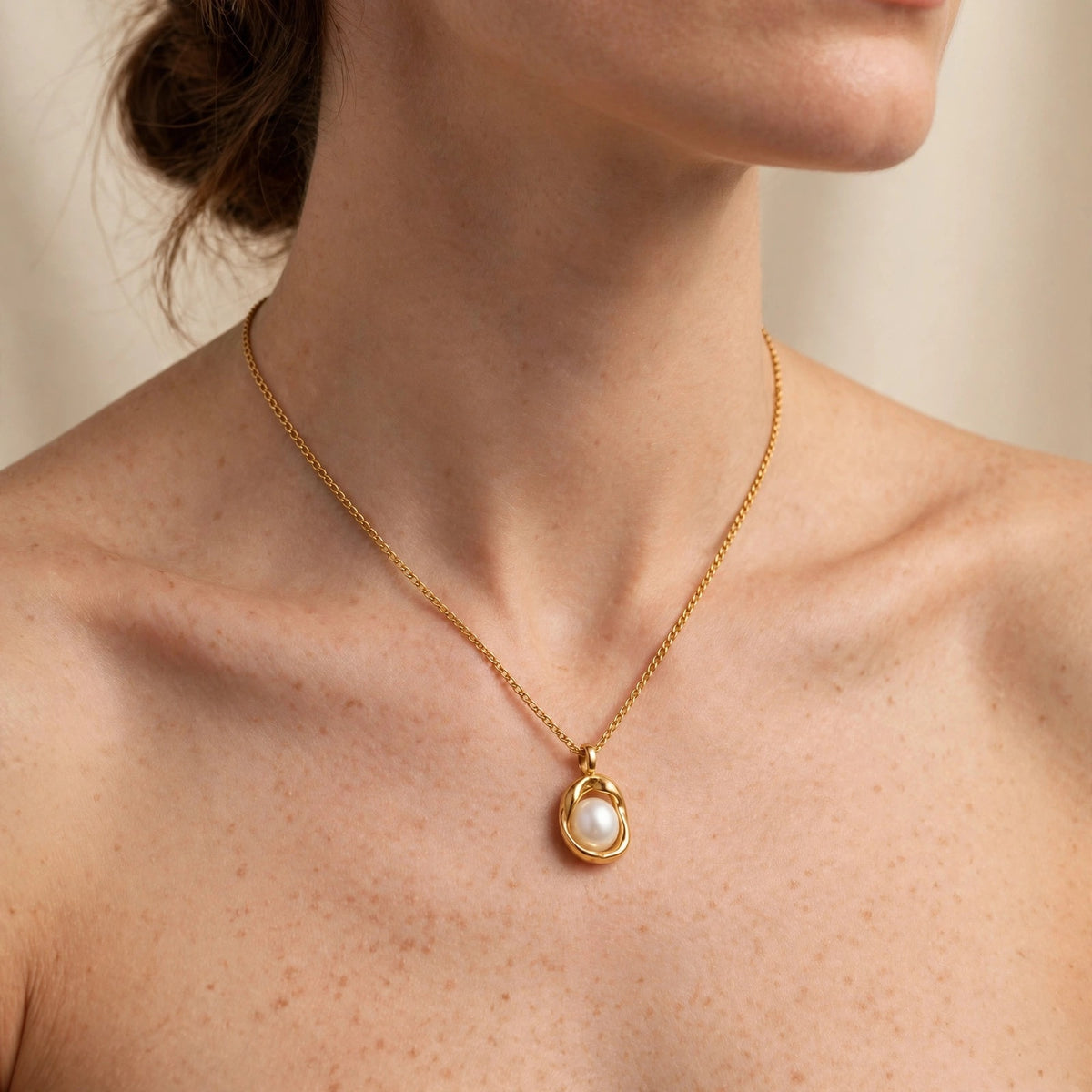 Valora pearl pendant necklace worn at the collarbone