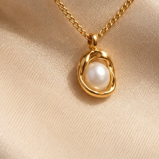 Close-up of the Valora oval pendant — freshwater pearl in gold-tone frame